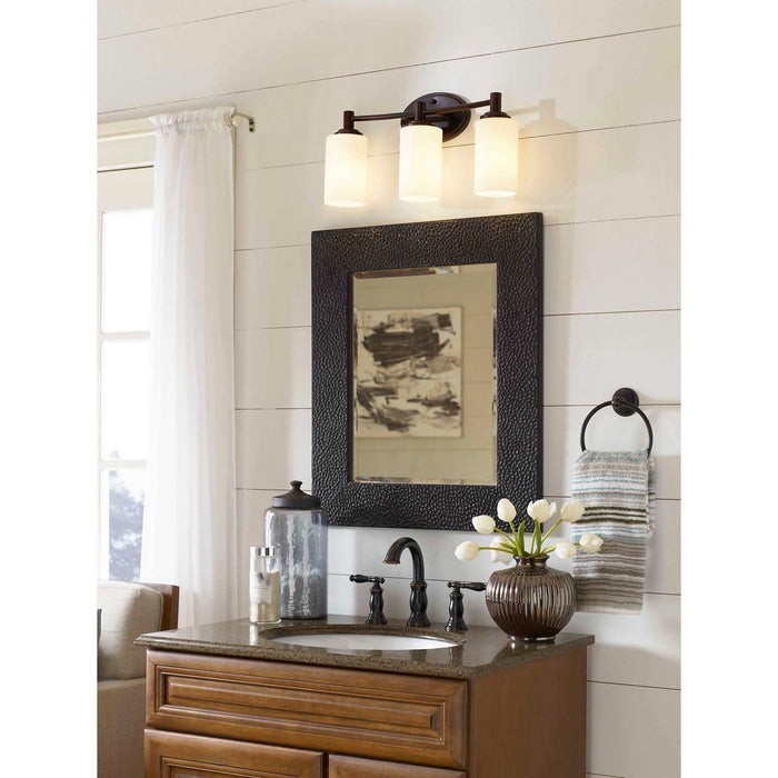Three Light Wall Lamp from the Pittman collection in Sienna Bronze finish