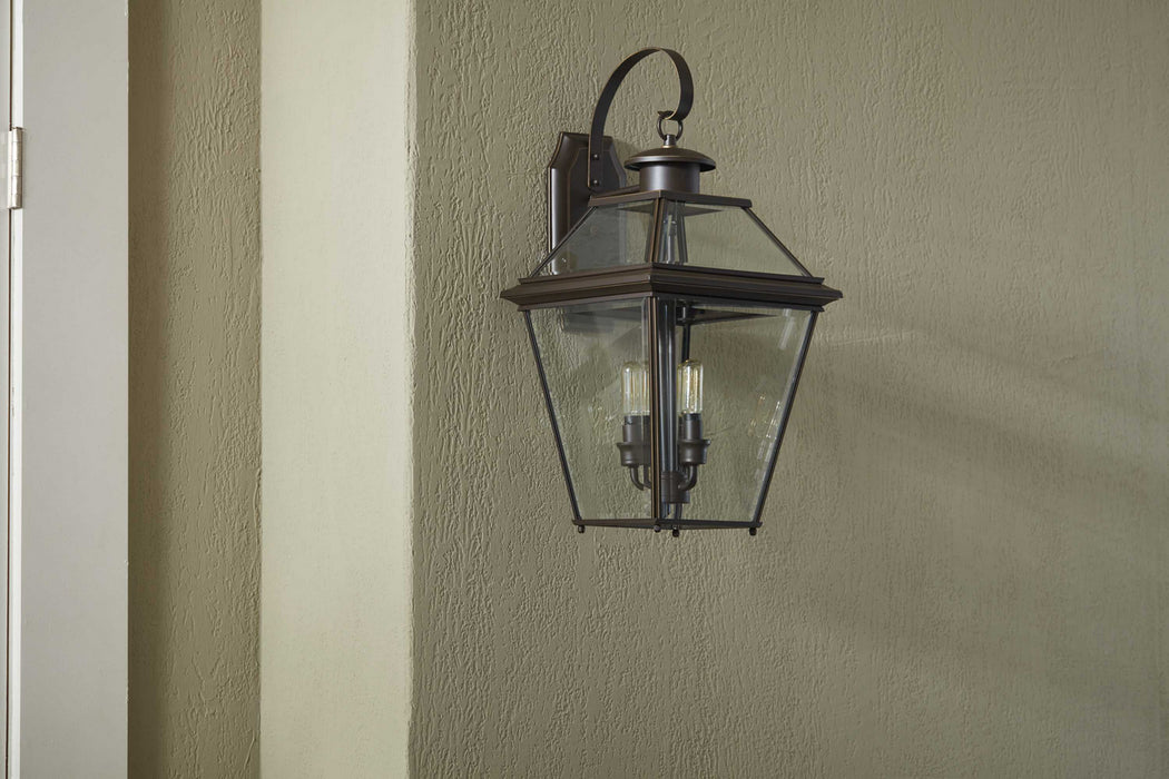 Three Light Wall Lantern from the Burlington collection in Antique Bronze finish