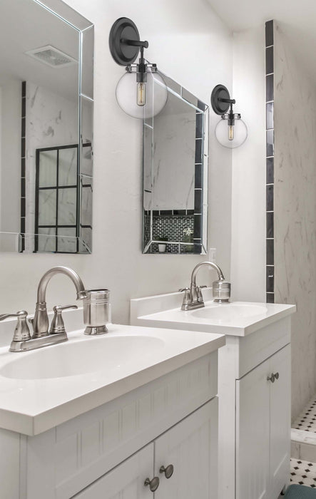 Span Bath Vanity Light shown in the Matte Black finish with a Clear shade