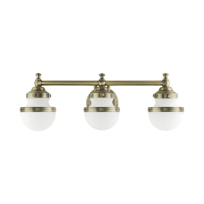 Three Light Vanity from the Oldwick collection in Antique Brass finish