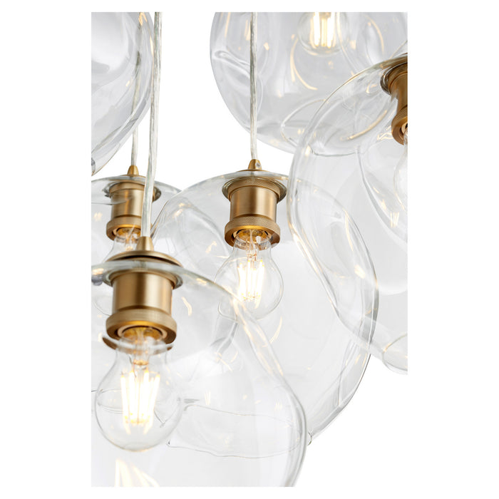 Seven Light Pendant from the Numen collection in Aged Brass finish